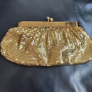 Small and shiny party clutch